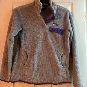 Patagonia pullover with pockets and buttons.